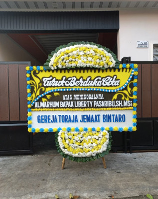 Papan Bunga Duka di Pengantungan
